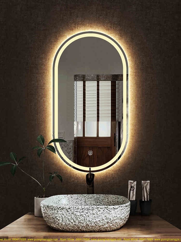Gương phòng tắm OVAL đèn LED cảm ứng: Gương phòng tắm OVAL đèn LED cảm ứng không chỉ là một món đồ trang trí đẹp mắt mà còn là một tính năng thông minh tiện ích. Được thiết kế với chất liệu chịu nước, thiết bị này là sự lựa chọn tuyệt vời cho mọi gia đình. Đèn Led sáng chói, tạo nên không gian tắm cực kỳ sang trọng và hiện đại.